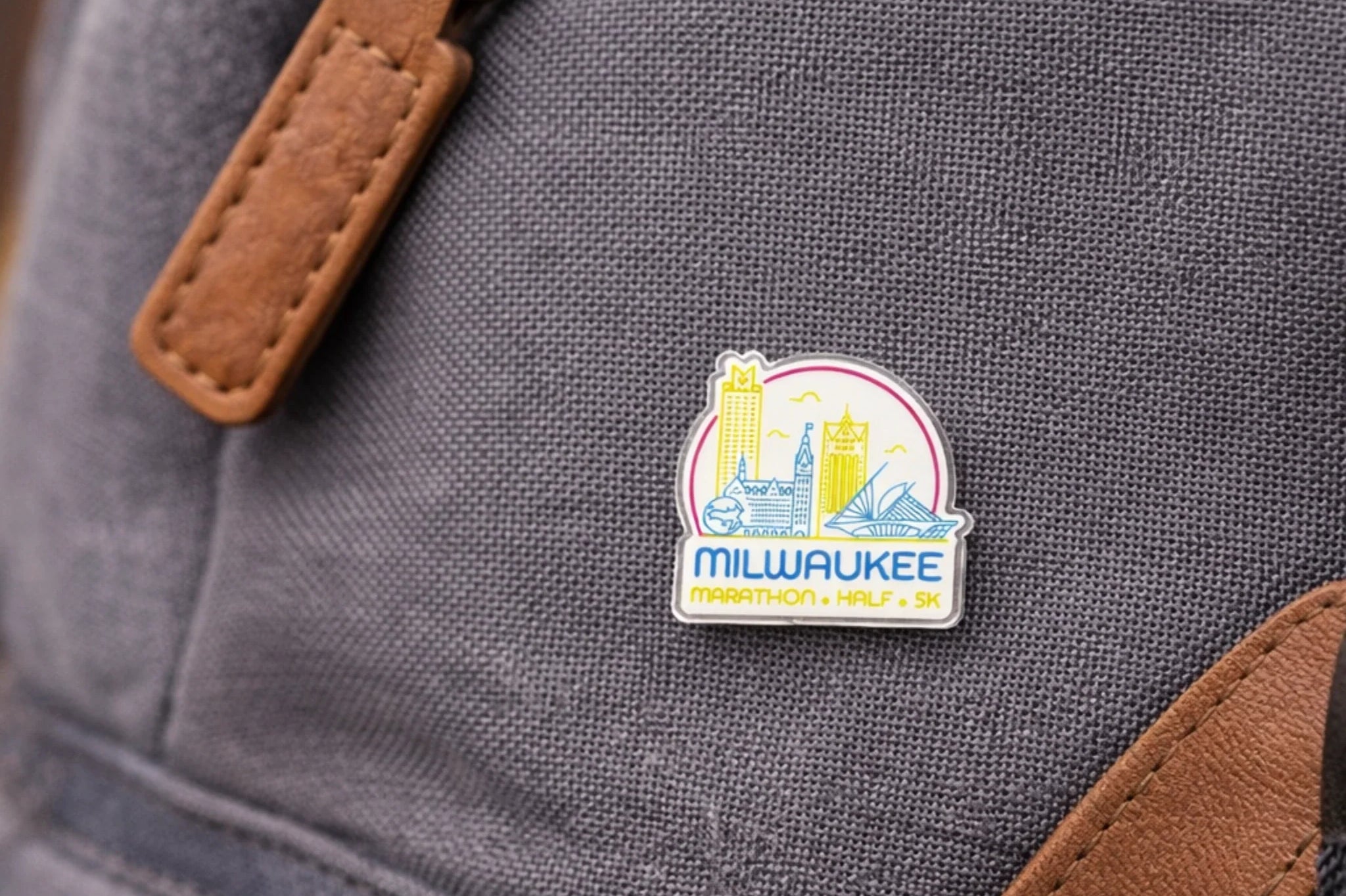 Gray backpack with a Milwaukee Marathon pin