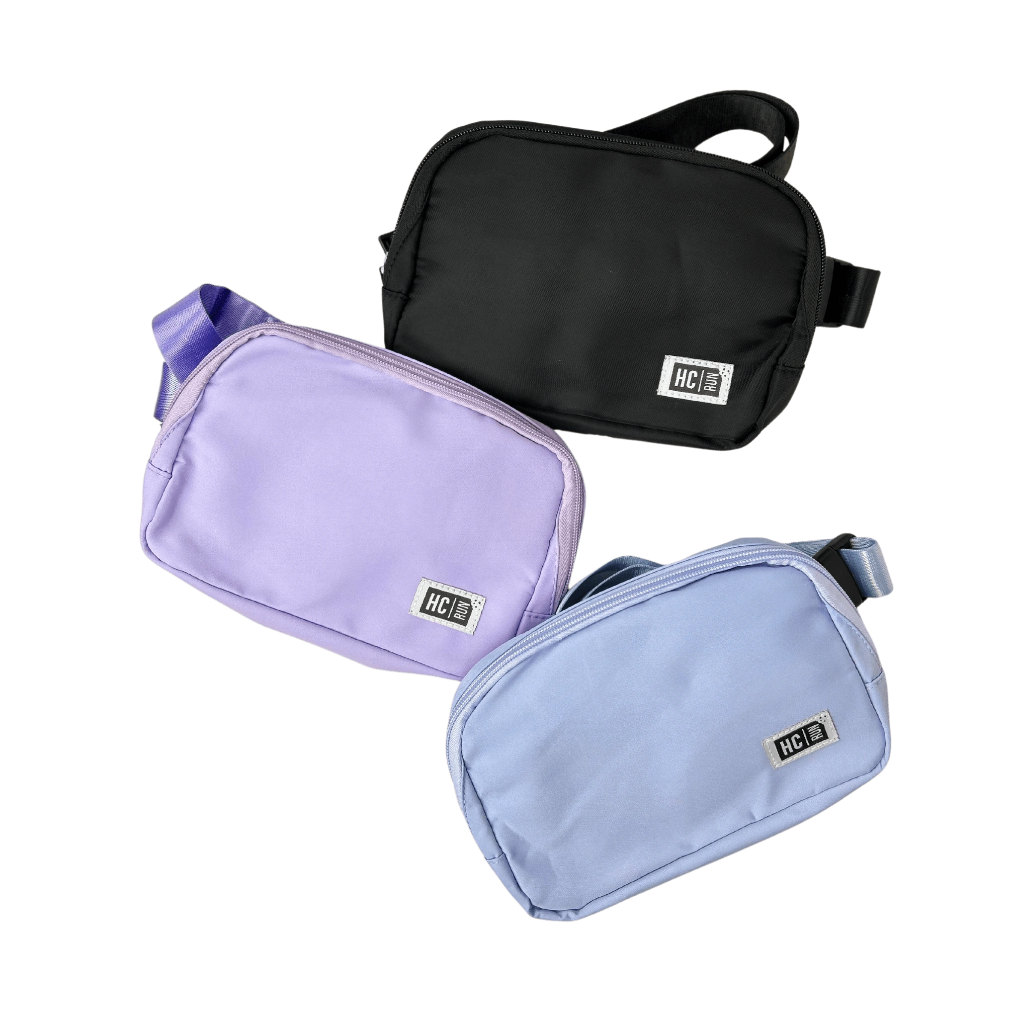Three waist bags in black, purple, and light blue with HC Run logo in left corners