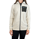 Person wearing a cream-colored fleece jacket with a black pocket