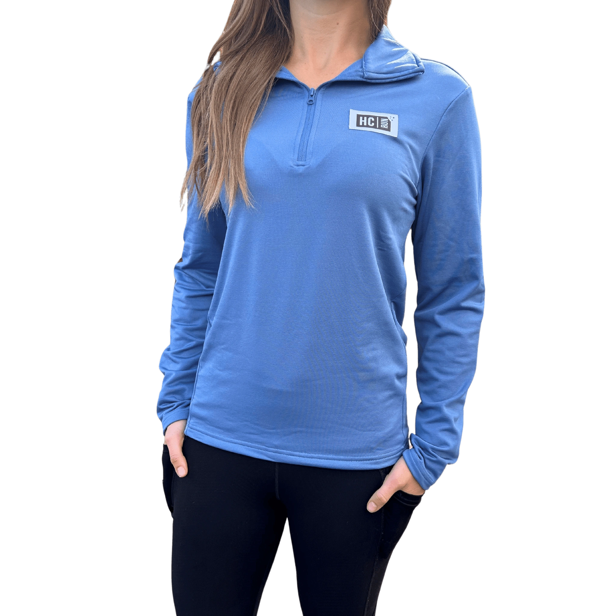 Person wearing a blue long-sleeve quarter zip with HC Run logo