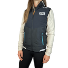Person wearing a white fleece jacket under a fully zipped black running vest with HC Run logo on left chest