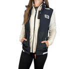 Person wearing a white fleece jacket under a black running vest with HC Run logo on left chest