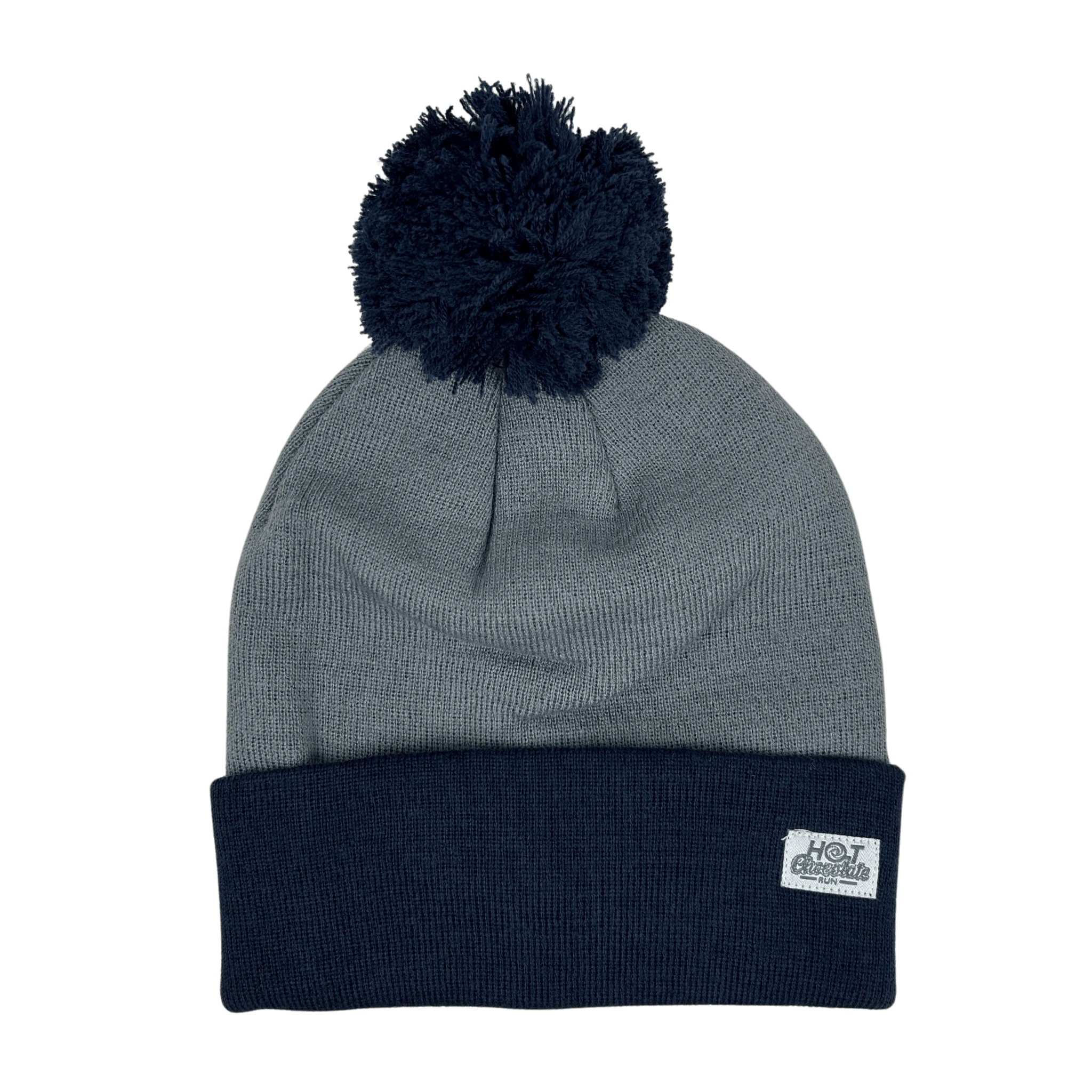 Cool blue pom-pom beanie with white label in corner