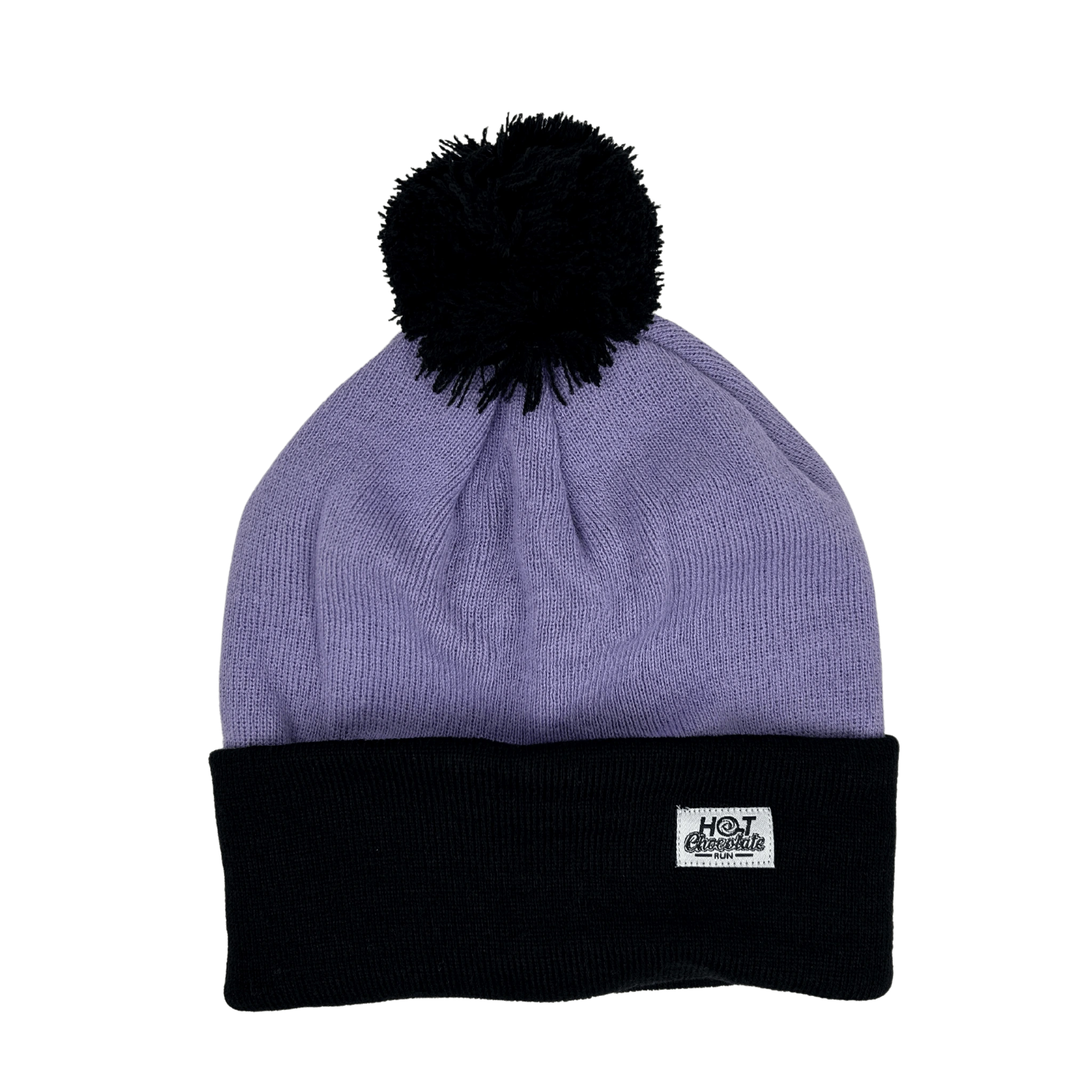 Lavender pom-pom beanie with white label in corner