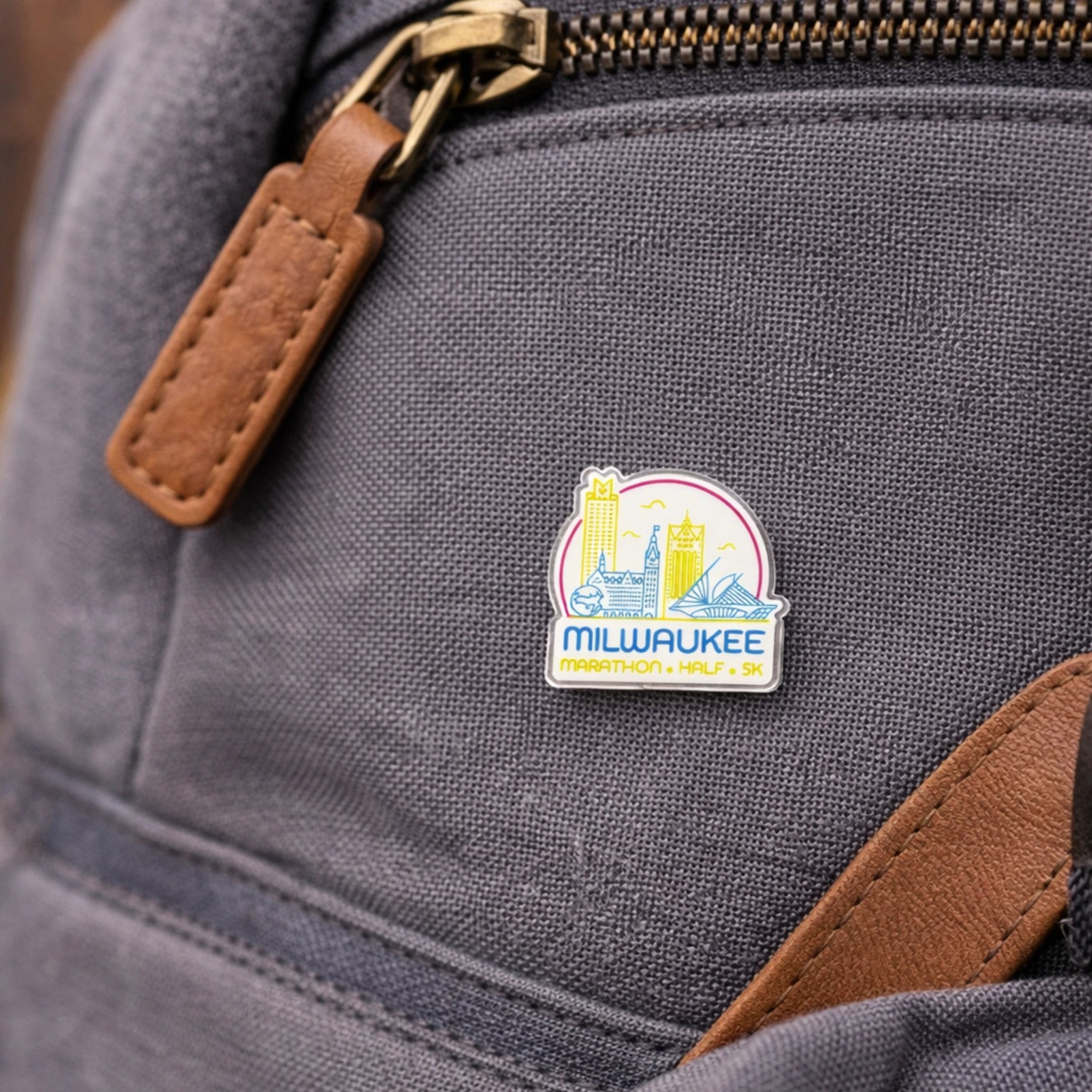 Gray backpack with a Milwaukee Marathon pin