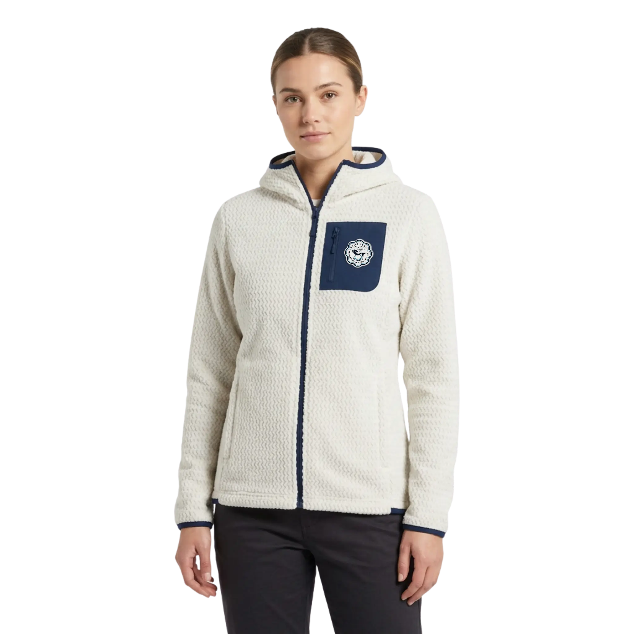 Woman wearing a cream-colored fleece jacket with a navy pocket with Maine Coast Marathon Logo