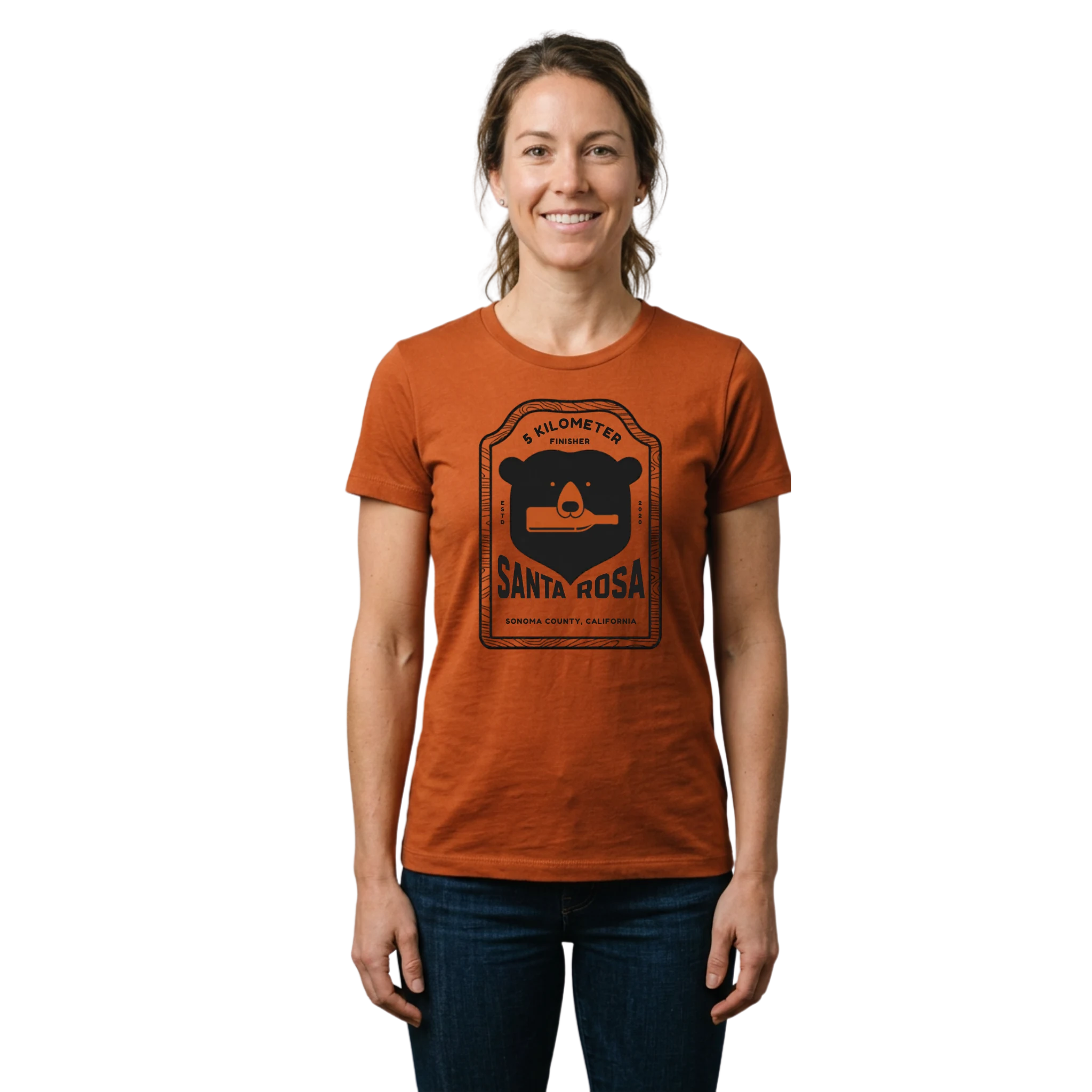Woman wearing a rust-colored t-shirt with a black Santa Rosa Marathon 5K graphic and text on front