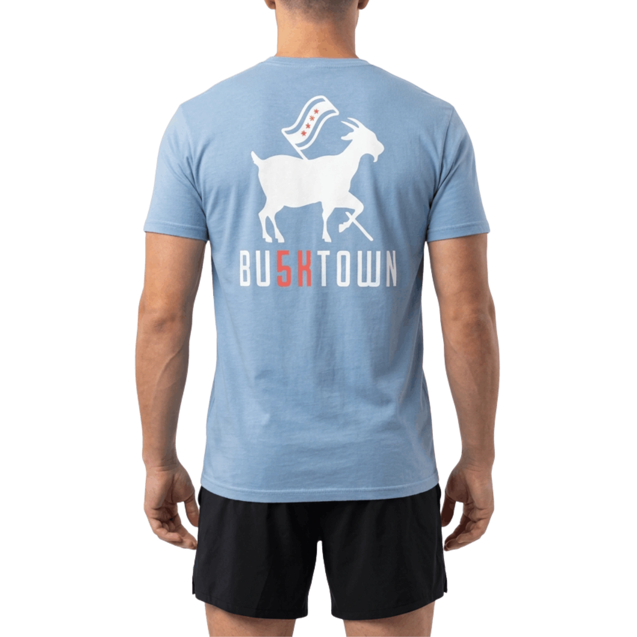 Person wearing a blue t-shirt with a graphic and 'BU5KTOWN' text on the back