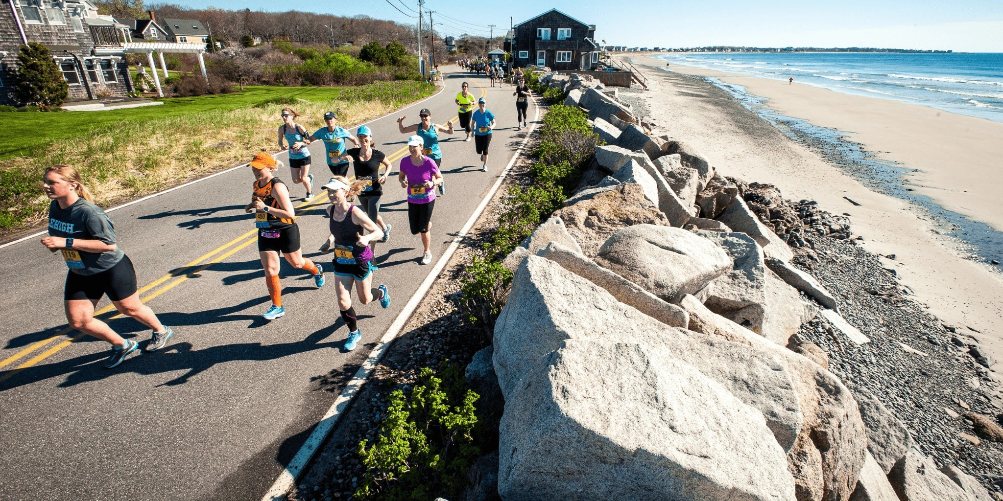 Runners next to a beach for Maine Coast Marathon