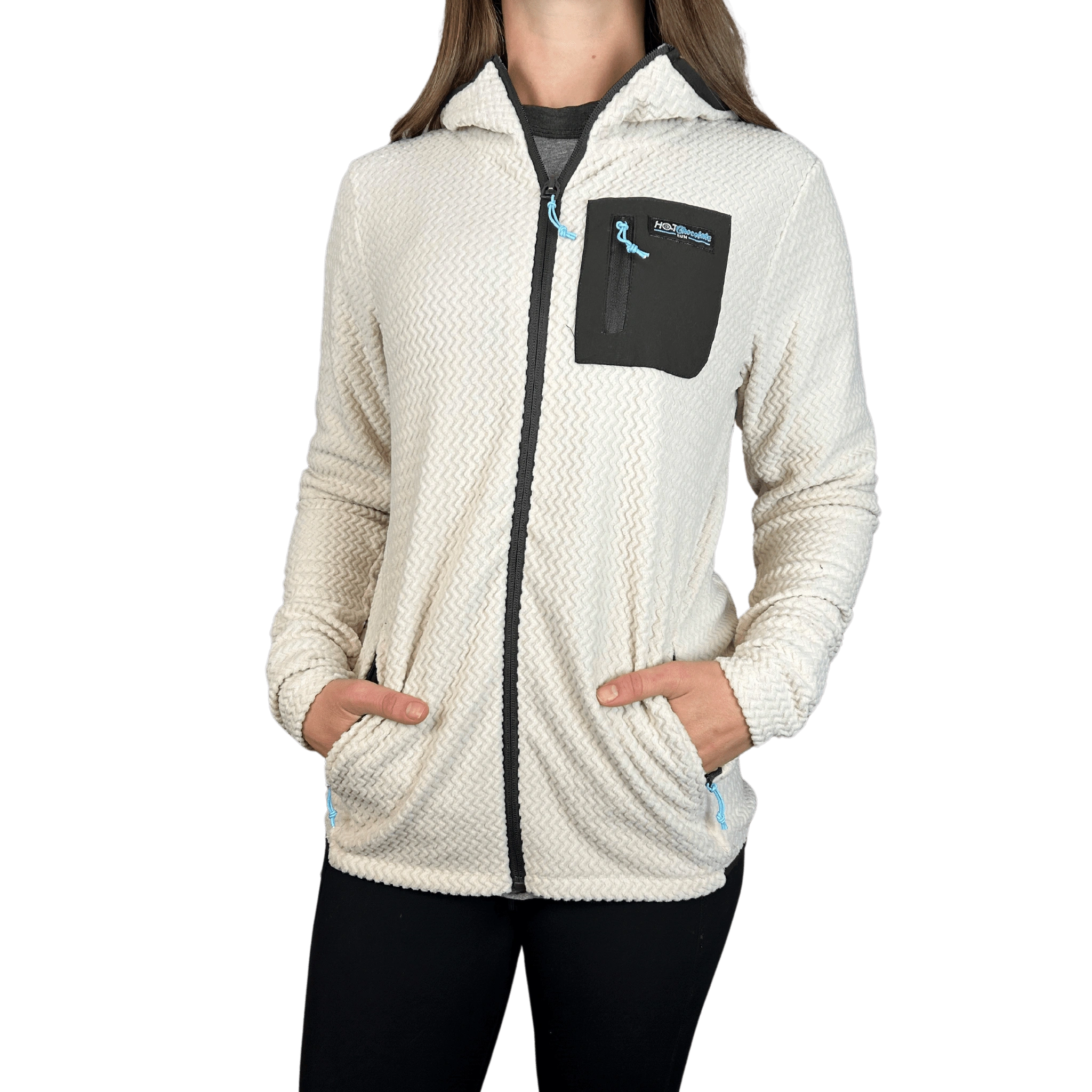 Person wearing a cream-colored fleece jacket with a black pocket