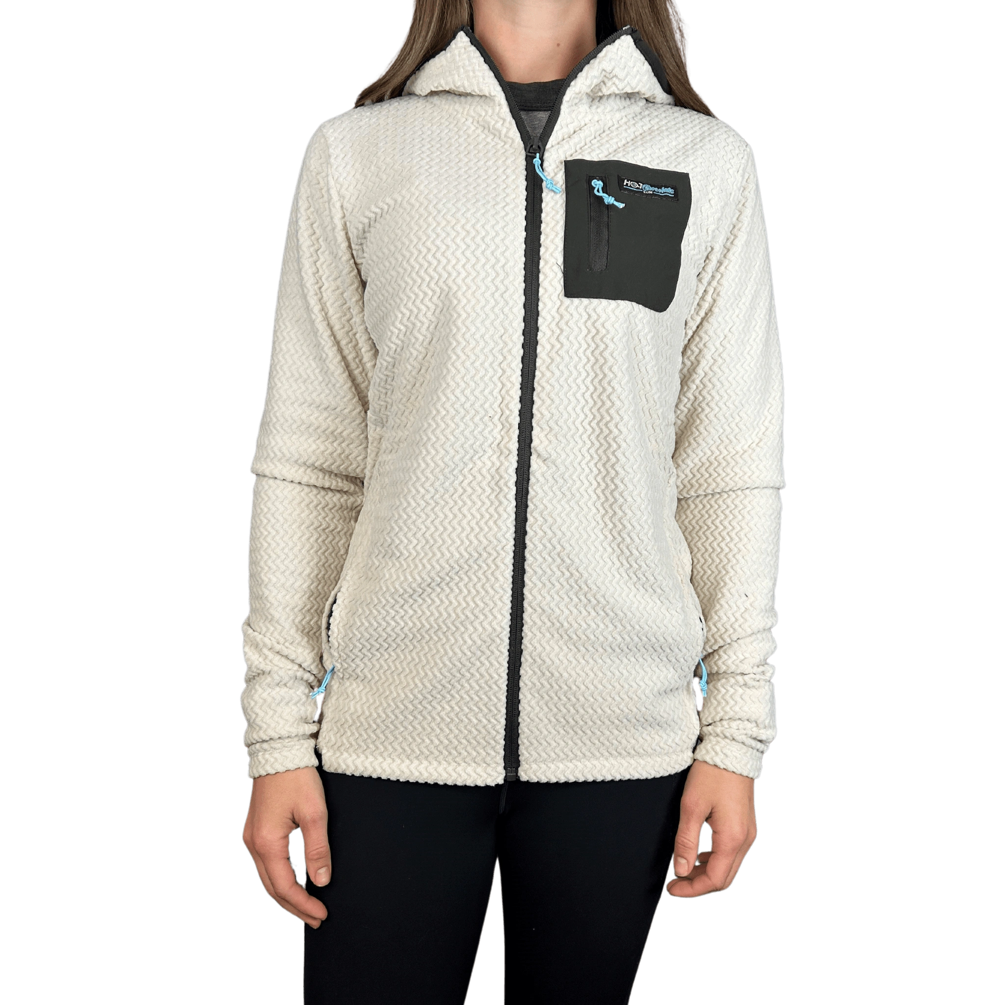 Person wearing a cream-colored fleece jacket with a black pocket