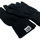 Black gloves laying flat with closeup of HC Run label on bottom