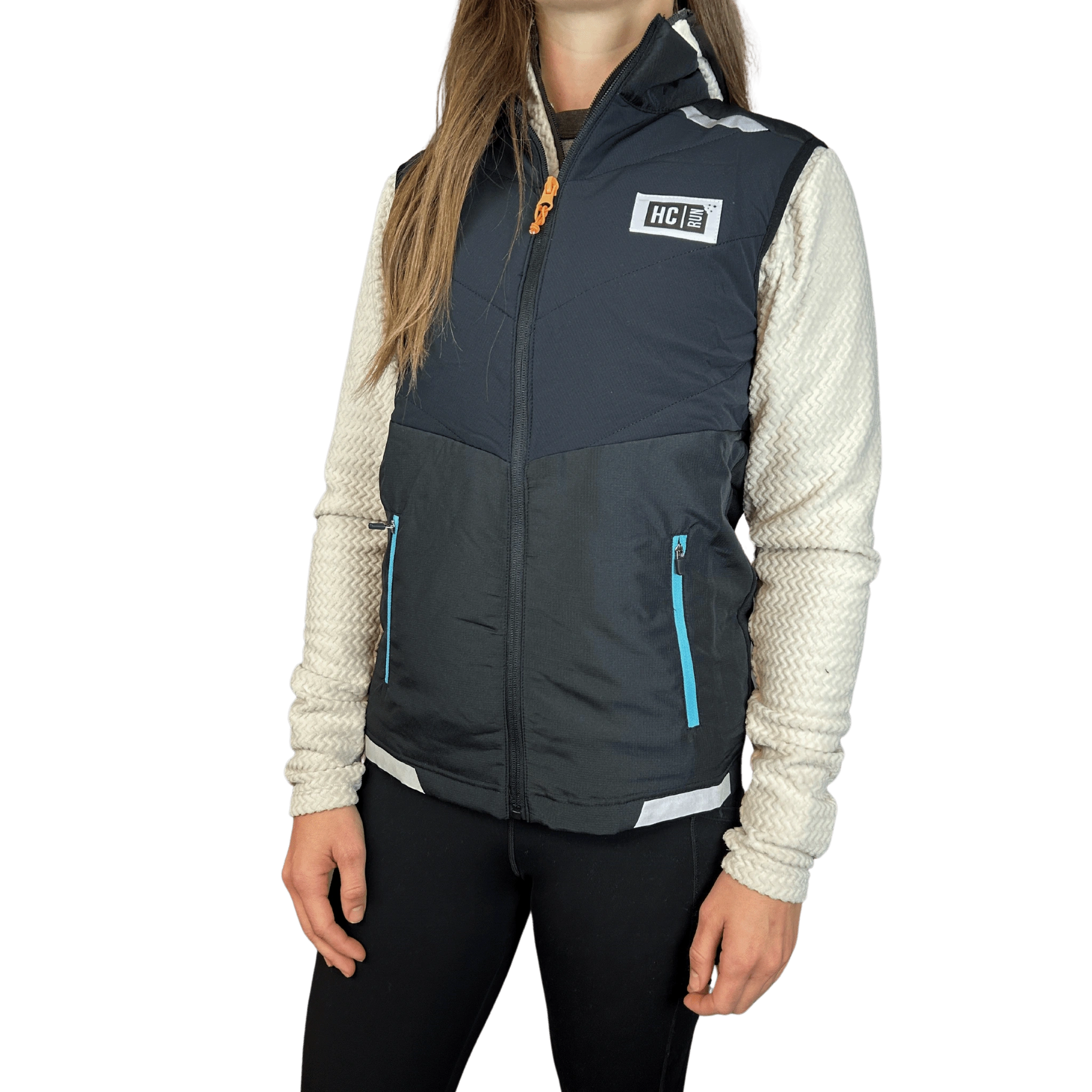 Person wearing a white fleece jacket under a fully zipped black running vest with HC Run logo on left chest