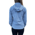 Backside of person wearing a light blue jacket