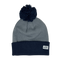 Cool blue pom-pom beanie with white label in corner