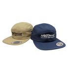 Two hats, one beige and one navy, with 'Hot Chocolate Run' logos