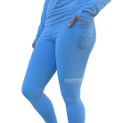 Blue leggings with a visible Hot Chocolate Run logo on side of leg 