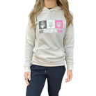 Woman wearing a beige hoodie with colorful graphic design and Hot Chocolate Run text