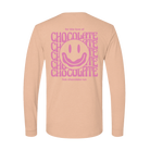 Peach long-sleeve shirt with pink 'love of chocolate' text and smiley face 