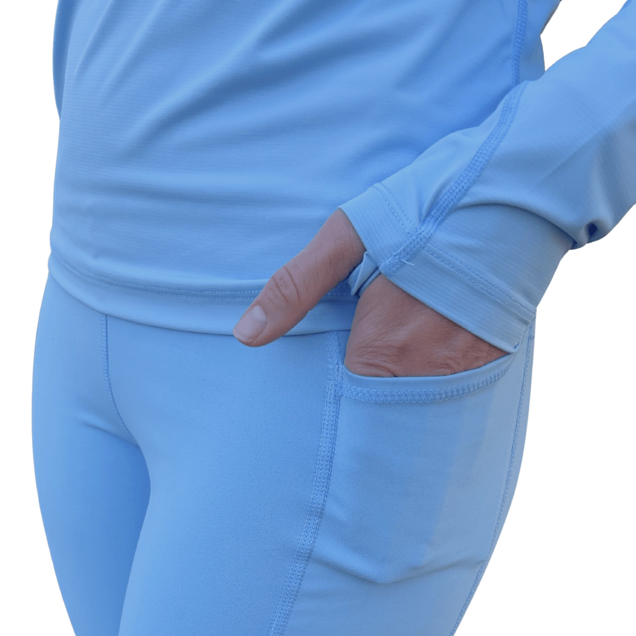 A close up of a hand in a light blue long-sleeve shirt with built in thumb hole