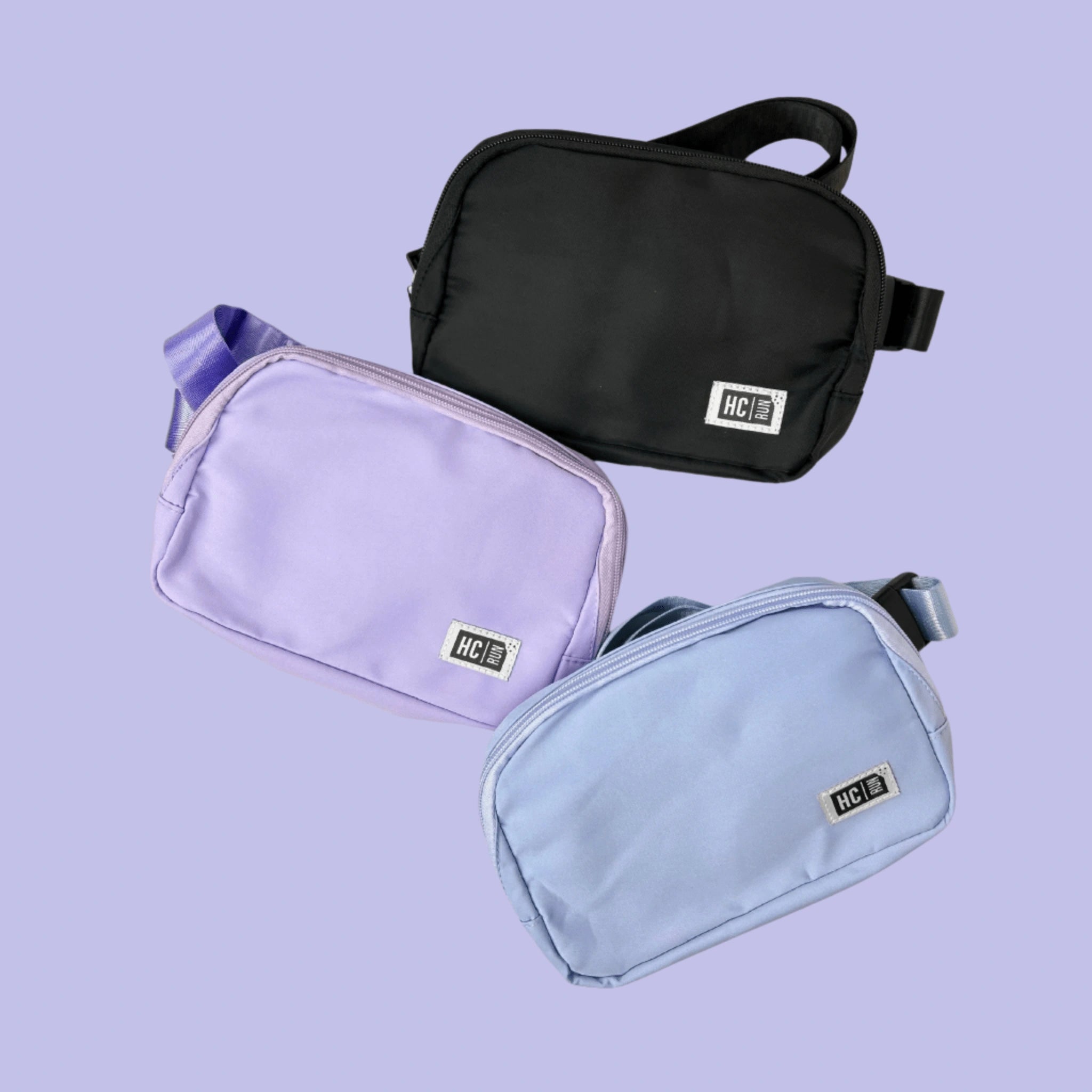 Hot Chocolate Run three bags in purple, black, and blue