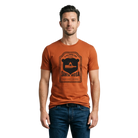 Man wearing a rust-colored t-shirt with a black Santa Rosa Marathon 5K graphic and text on front 