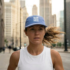 Woman running in Chicago with Run Mag Mile cap