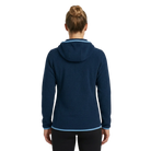 The back of a woman wearing a navy blue fleece textured hoodie