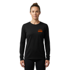 Woman wearing a black long-sleeve shirt with orange Santa Rosa Marathon logo