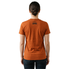 Woman wearing an orange t-shirt with a Santa Rosa Marathon logo on the back
