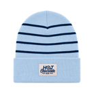Light blue beanie with dark blue stripes and 'Hot Chocolate Run' patch