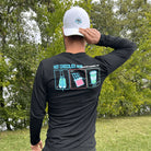Man outside wearing white hat and black long sleeve with Hot Chocolate Run text and panel design