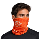 Person wearing an orange neck fabric with white Hot Chocolate 15K/5K text