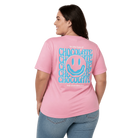 Person wearing a pink t-shirt with a smiley face and Hot Chocolate Run text