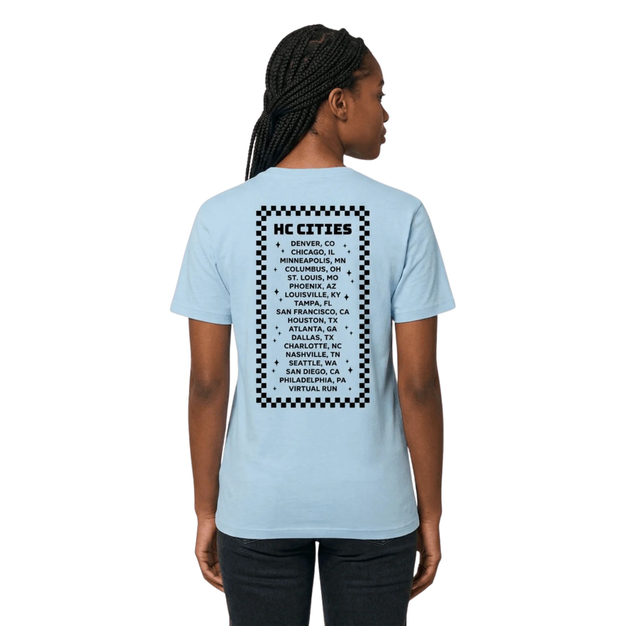Person wearing a light blue t-shirt with black text and checkered pattern