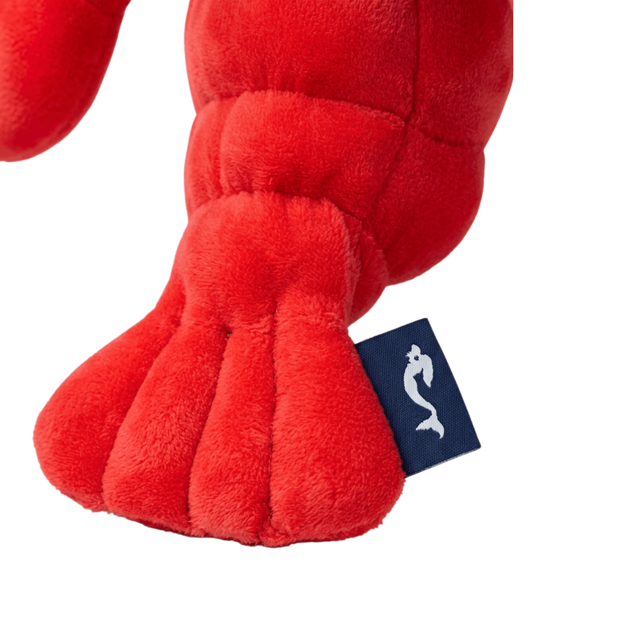 Red plush toy with a brand tag