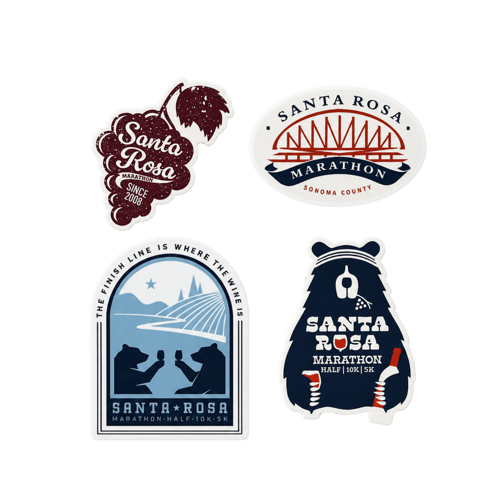 Four Santa Rosa Marathon themed stickers including a grape cluster design, an oval bridge graphic, an archway finish-line illustration, and a bear 