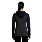 Person wearing a black and purple hoodie from the back